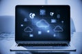 Close up of laptop at workplace with creative digital cloud computing hologram on blurry background. Cloud data and service