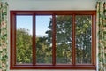 Close-up of Large four pane window with summer landscape.