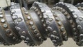 Closeup of a large industrial drill bit with numerous carbide inserts designed for heavyduty drilling operations in mining or Royalty Free Stock Photo