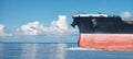 Close up of large red merchant crago ship in the ocean underway Royalty Free Stock Photo