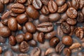 close-up large roasted coffee beans in smoke