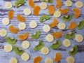 Close-up of a large round fruit candy on a background of slices of kiwi, mandarin Royalty Free Stock Photo