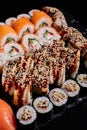 Close up of a large set of various sushi rolls with various fresh fish and vegetable fillings. Royalty Free Stock Photo