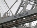 Close up of large shipping crane featuring Port of Oakland Sign