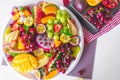 Close up large tray of sliced assorted fresh tropical fruits platter Royalty Free Stock Photo