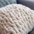 A close up of a large white knitted blanket, AI