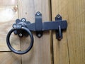 Close-up of latch on shut wood gate Royalty Free Stock Photo