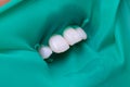 Close-up latex plate designed to isolate the tooth to be treated from the rest of the oral cavity during treatment.