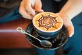 Close up of Latte coffee in grass cup on table