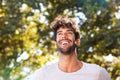 Close up laughing handsome man with beard outside in nature Royalty Free Stock Photo