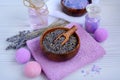 Close-up of lavender flowers in a wooden bowl on a lilac towel. Spa and beauty treatments concept Royalty Free Stock Photo