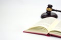 Close up law book and blurred the judge gavel or hammer placed behind. Royalty Free Stock Photo