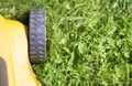 Close-up of a lawn mower on green lawn grass, web banner Royalty Free Stock Photo