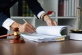 Close up lawyer hands holding pen, signing in white paper form or application to confirm and deal contract agreement Royalty Free Stock Photo