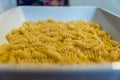 Close up layer of fusilli pasta in baking ceranic tray Royalty Free Stock Photo