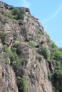 close-up of a layered granite rock mountain with lava flow stratifications in evidence Royalty Free Stock Photo