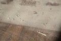 Close up layered grimy dust on faux wood grain floor Royalty Free Stock Photo