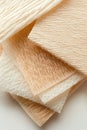 Close up of layered wrinkled paper sheets with textured surface in soft cream and beige tones. Royalty Free Stock Photo