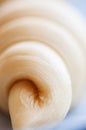 Close up of layers of Semifinished or unbaked croissant on a baking sheet. Puff pastry baking. Selective focus Royalty Free Stock Photo