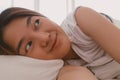 Close up of lazy Asian woman just wake up but not get up from the bed.