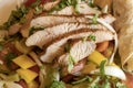 Close-up of lean meat on vegetables with pita bread