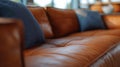 A close up of a leather couch with blue pillows on it, AI