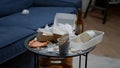 Close up of leftover food on table in empty messy living room