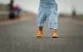 close up leg of infant baby learning to walking first step on pathway Royalty Free Stock Photo