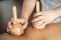 Maderotherapy anti cellulite massage treatment with wooden vacuum cup