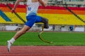 close-up legs athlete runner on prosthesis running stadium track