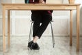 Close up legs of business lady at desk anticipating meeting. Royalty Free Stock Photo