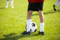 Close up legs and feet of football player in white socks and bl Royalty Free Stock Photo