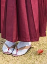 Woman in hakama kimono with geta shoes on the grass in autumn. Royalty Free Stock Photo