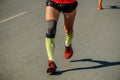 close-up legs male runner in compression socks and knee pads Royalty Free Stock Photo