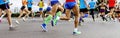 close-up legs runners, men and women Royalty Free Stock Photo