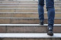 Close up legs shoes of young business man One person walking stepping going up the stairs in modern city, go up, success, grow up.