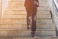 Close up legs shoes of young business man One person walking stepping going up the stairs Royalty Free Stock Photo