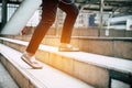 Close up legs of traveling people walking on stepping up stair i Royalty Free Stock Photo