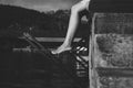 Close up legs woman sitting and feeling depression near river,Mental disorder health care,World suicide prevention day concept,Bla Royalty Free Stock Photo