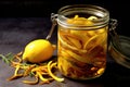 close-up of lemon peels infusing in glass jar