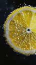 Close-up of a lemon slice with bubbles in water Royalty Free Stock Photo