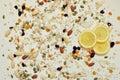 Close up of lemon slices, seeds and cereals on an white background.