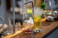the lemonade drink with ice in a clear glass beside a glass tube and the laboratory, adjust the flavor to the right, Royalty Free Stock Photo