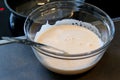 Close up of a lentils batter in glass bowl with a ladle