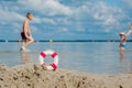 Close-up Of Lifebuoy on the beach on baby background. Safety on the water Royalty Free Stock Photo