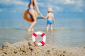 Close-up Of Lifebuoy on the beach on baby background. Safety on the water Royalty Free Stock Photo