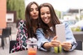 Close up lifestyle selfie portrait of pretty fresh young brunette best friends girls making selfie, having fun Royalty Free Stock Photo