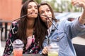 Close up lifestyle selfie portrait of pretty fresh young brunette best friends girls making selfie, having fun Royalty Free Stock Photo