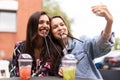 Close up lifestyle selfie portrait of pretty fresh young brunette best friends girls making selfie, having fun Royalty Free Stock Photo