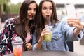 Close up lifestyle selfie portrait of pretty fresh young brunette best friends girls making selfie, having fun Royalty Free Stock Photo